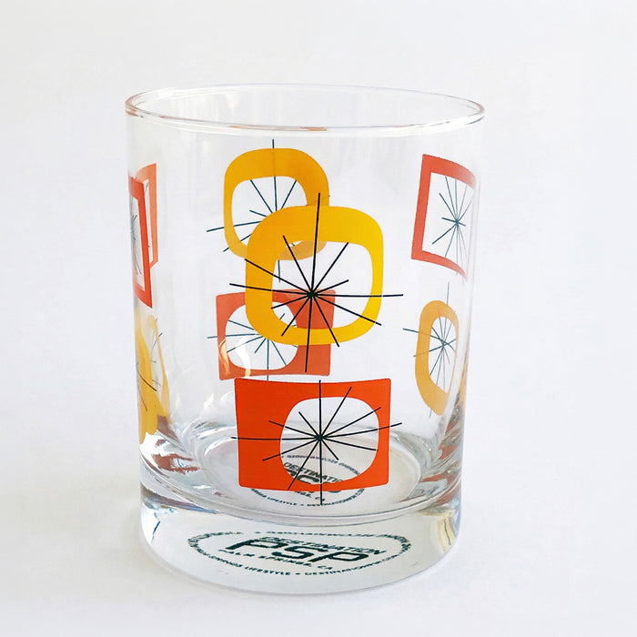 A red and orange retro old fashioned cocktail glass