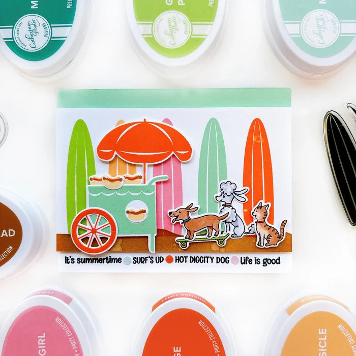 Catherine Pooler - Stamp & Die Set - On the Boardwalk. This set is perfect for building scenes, clustering or simple cards. This set includes a palm tree, surf board, the boardwalk fence and all the bits to build your own treat cart. Available at Embellish Away located in Bowmanville Ontario Canada. Example by Catherine Pooler Designs.