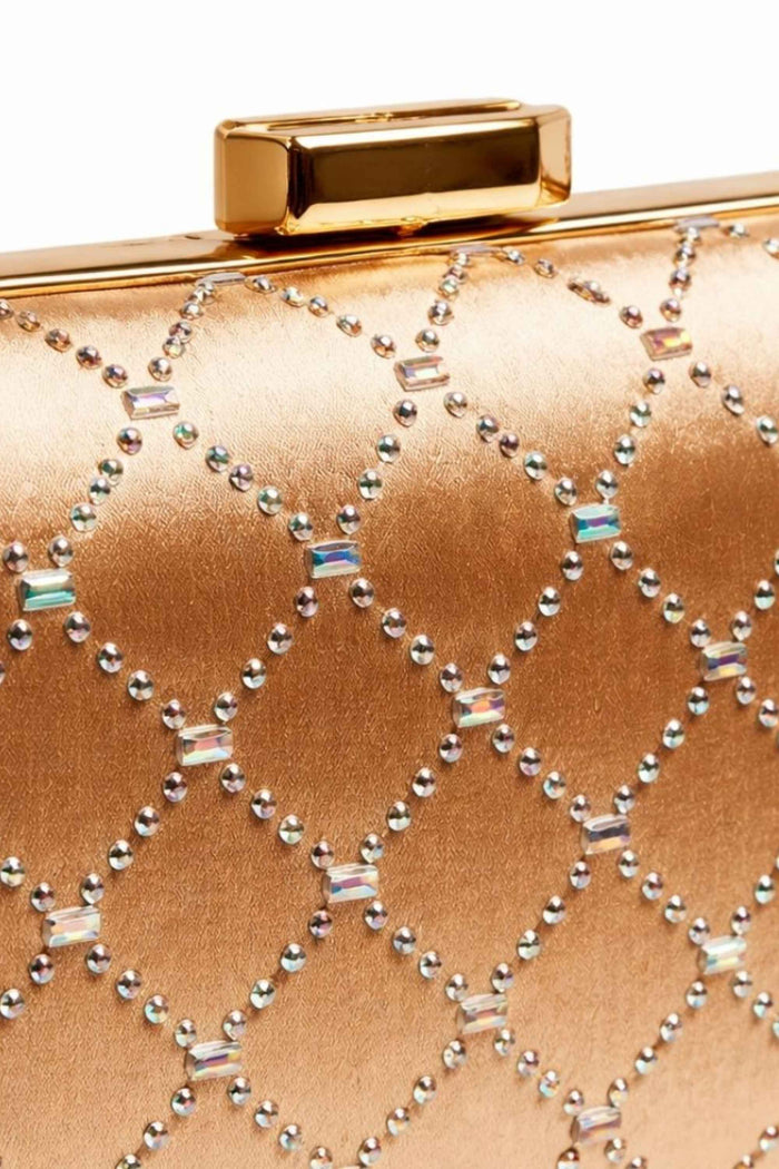 Close-up of the gold clutch's detailed diamond pattern made of iridescent beads and small metallic studs, with a polished gold clasp.