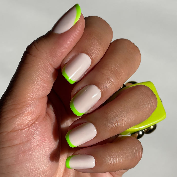Neon Lime French | Squoval | Short press-on nails with a neutral base and vivid lime green tips for a fresh manicure look