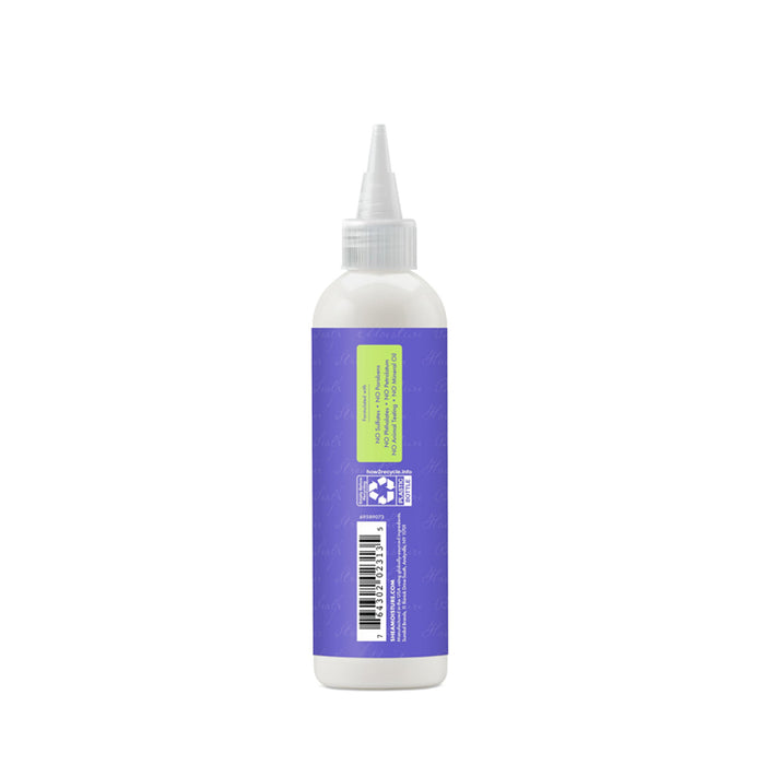 Shea Moisture anti-dandruff pre-wash white squeeze bottle with pointed nozzle and purple label back view