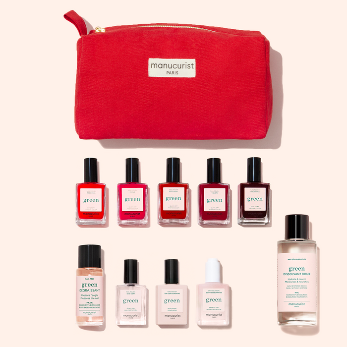 The Manucurist Super Starter Kit features a red pouch above ten manicure products, including plant-based red and pink polishes, clear bottles, and two large nail polish removers for a complete Green manicure routine.
