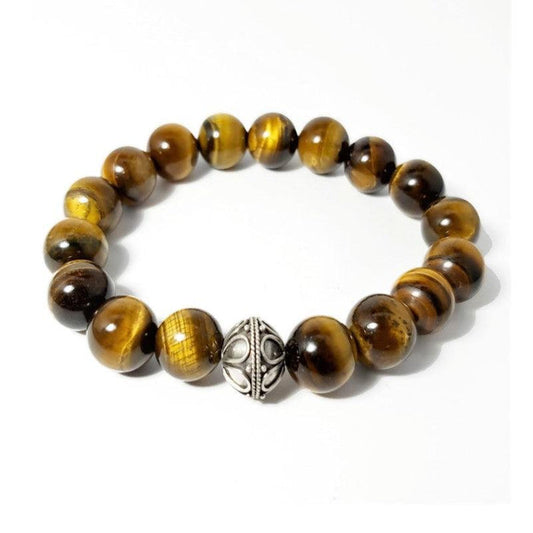 Tiger Eye and Silver Bead BraceletThis 12mm Tiger Eye elasticated bead bracelet with a 14X8mm 925 silver bead. This a true piece of art you'll be proud to own and happy to wear for any occasion. As aBead BraceletsT.M.JTheodore Men's JewelryTiger Eye and Silver Bead Bracelet