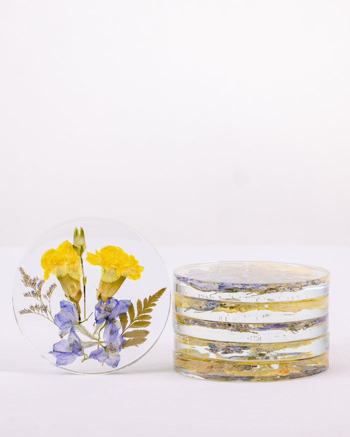 Tall portrait photo of round pressed flower coasters with blush dried roses