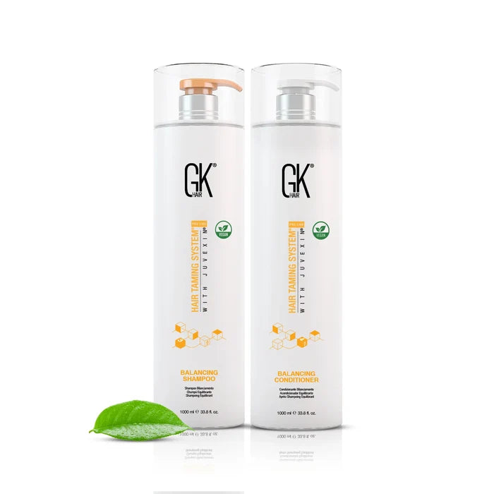 GK Hair Balancing Shampoo and Balancing Conditioner, both 1000 ml, with a green leaf in the foreground.