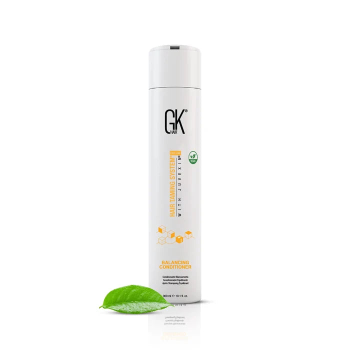 GK Hair Balancing Conditioner, 300 ml with a green leaf in the foreground.