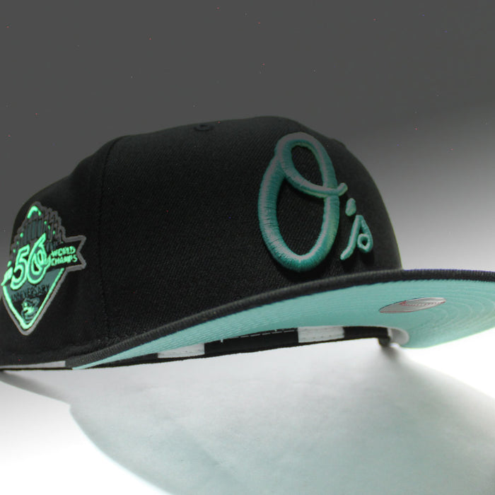 Baltimore Orioles 50th Anniversary 59Fifty New Era Fitted Hat (Glow in the Dark Black Mint Under Brim)