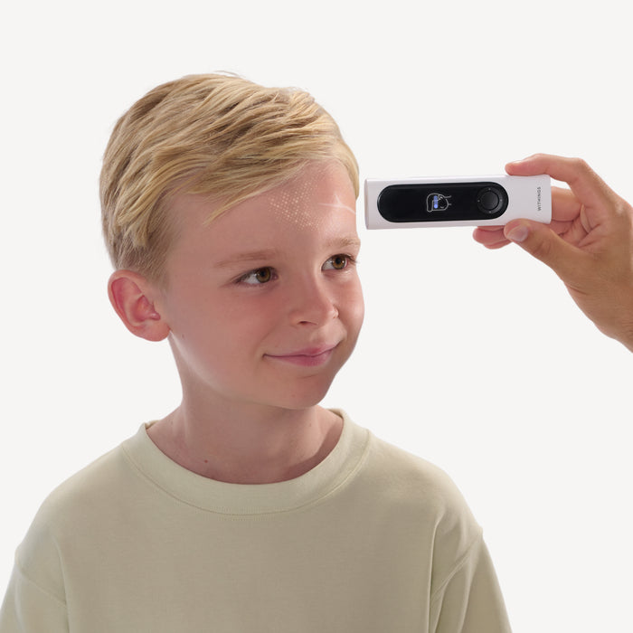BeamO — Beam-O — Adult hand holding the device to measure a smiling blonde child's forehead temperature, white background — forehead scan, child, adult hand, close-up