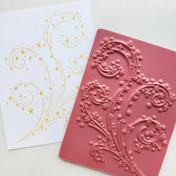 Catherine Pooler - Background Stamp - It's Magic. Inspired by the beloved Swirling Snow and Blowing Leaves designs, this stamp features a captivating swirl of dazzling stars that will bring a touch of Christmas magic to your cards. Available at Embellish Away located in Bowmanville Ontario Canada.