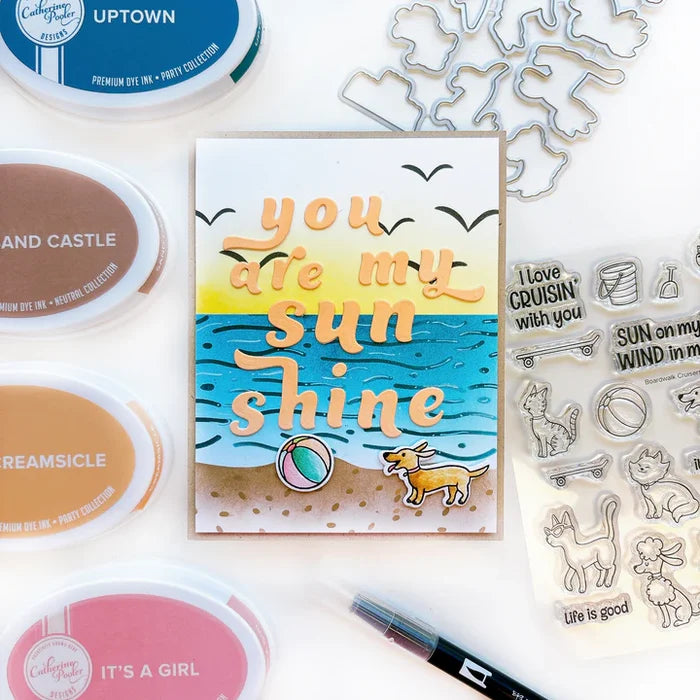 Catherine Pooler - Stamp &amp; Die Set - Boardwalk Cruisers. These perky pal cats and dogs love some fun. This stamp set includes pets that are ready to roll on their skateboard or longboard, play in the sand or eat your dropped ice cream cone! Available at Embellish Away located in Bowmanville Ontario Canada. Card example by Catherine Pooler Designs.
