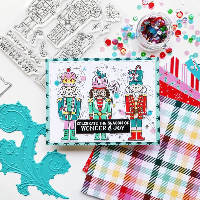 Catherine Pooler - Stamp &amp; Die Set - Nutcracker Sweet. Meet the cutest nutcrackers in town! This whimsical set features charming nutcrackers adorned in a delightful array of sweets and treats, including cupcakes, candy canes, and figgy pudding. Available at Embellish Away located in Bowmanville Ontario Canada. Example by Catherine Pooler Designs.