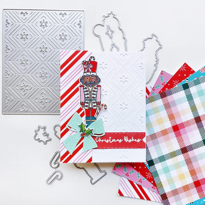 Catherine Pooler - Stamp &amp; Die Set - Nutcracker Sweet. Meet the cutest nutcrackers in town! This whimsical set features charming nutcrackers adorned in a delightful array of sweets and treats, including cupcakes, candy canes, and figgy pudding. Available at Embellish Away located in Bowmanville Ontario Canada. Example by Catherine Pooler Designs.