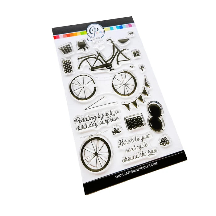 Catherine Pooler - Stamp &amp; Die Set - Pedaling By. Featuring a birthday bike with tons of fun decorations. Decorate with the gifts, balloons and bunting. There's also a basket that can be filled with flowers or a kitty to take along or the ride! Available at Embellish Away located in Bowmanville Ontario Canada.