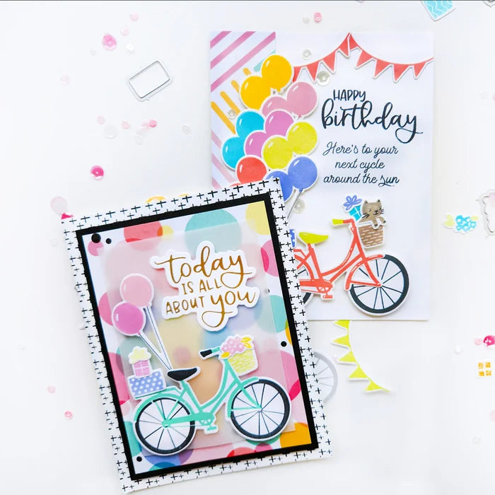 Catherine Pooler - Stamp &amp; Die Set - Pedaling By. Featuring a birthday bike with tons of fun decorations. Decorate with the gifts, balloons and bunting. There's also a basket that can be filled with flowers or a kitty to take along or the ride! Available at Embellish Away located in Bowmanville Ontario Canada. Example by Catherine Pooler Designs.