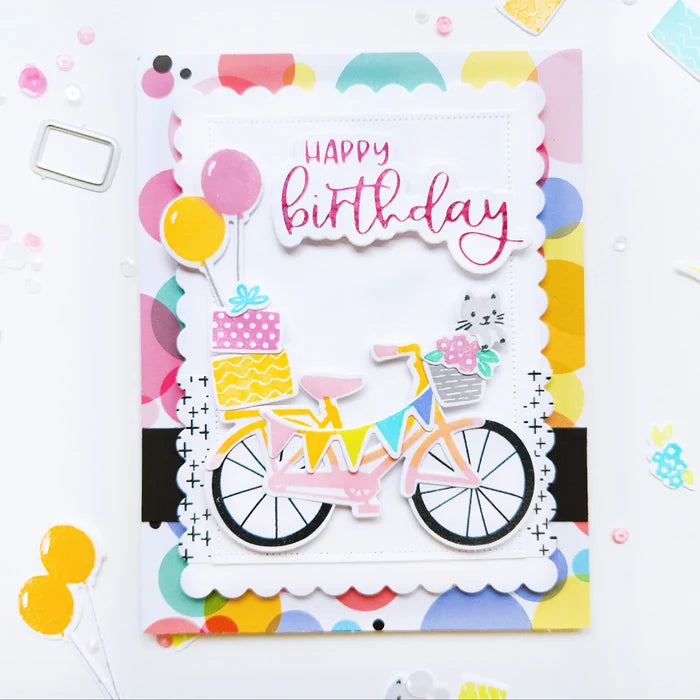 Catherine Pooler - Stamp &amp; Die Set - Pedaling By. Featuring a birthday bike with tons of fun decorations. Decorate with the gifts, balloons and bunting. There's also a basket that can be filled with flowers or a kitty to take along or the ride! Available at Embellish Away located in Bowmanville Ontario Canada. Example by Catherine Pooler Designs.