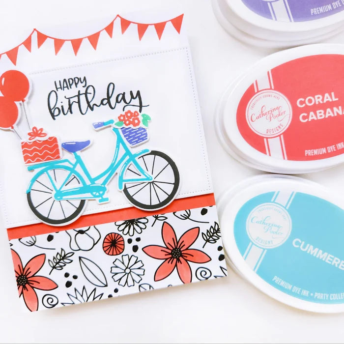 Catherine Pooler - Stamp &amp; Die Set - Pedaling By. Featuring a birthday bike with tons of fun decorations. Decorate with the gifts, balloons and bunting. There's also a basket that can be filled with flowers or a kitty to take along or the ride! Available at Embellish Away located in Bowmanville Ontario Canada. Example by Catherine Pooler Designs.