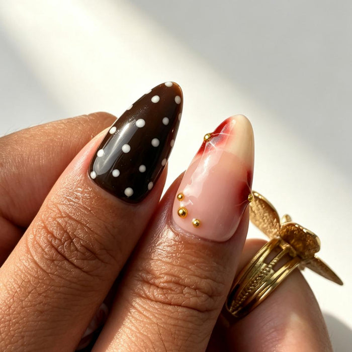 Brown black polka dot handmade fake nails close‑up