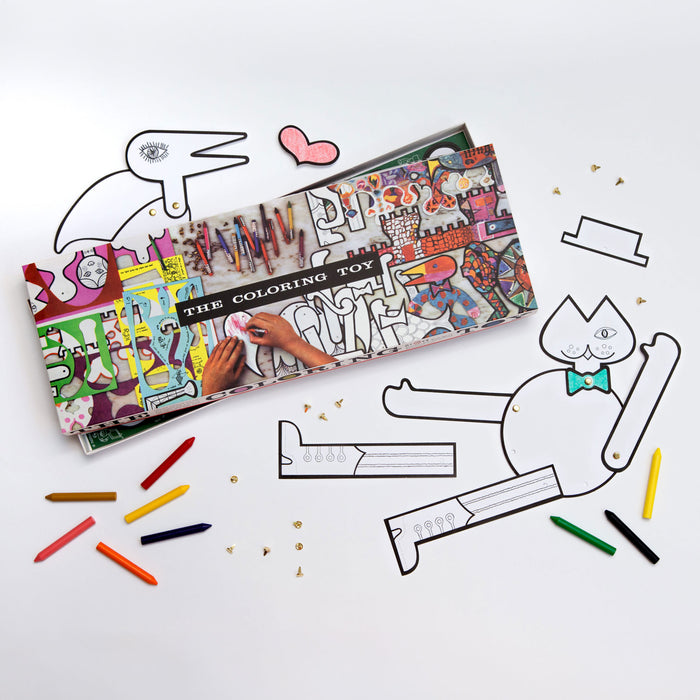Coloring toy set with coloring book, crayons, and cut-out shapes on a white background