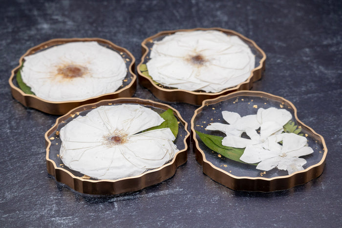Landscape photo of a pressed flower 12x8 geode tray with mixed dried botanical layers on a dark surface, new angle