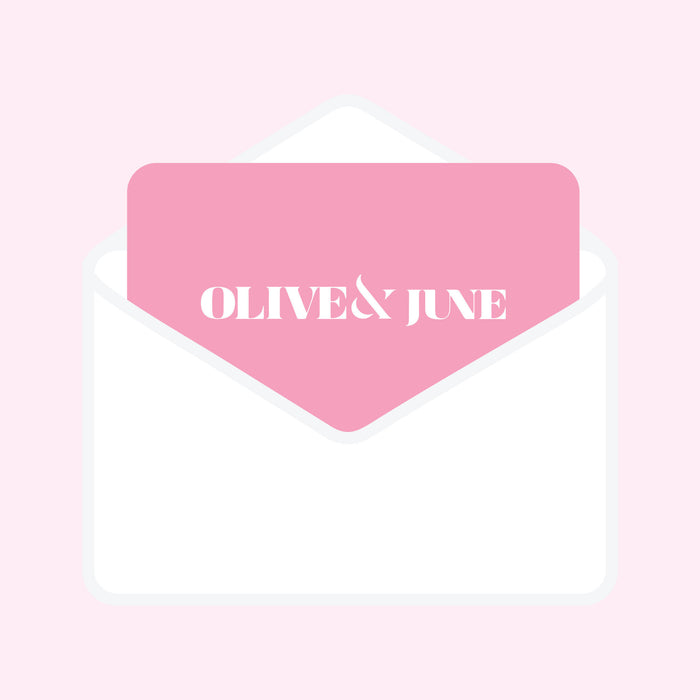 White envelope with a pink card displaying Olive and June logo representing the Gift Card for mani and pedicure gifts
