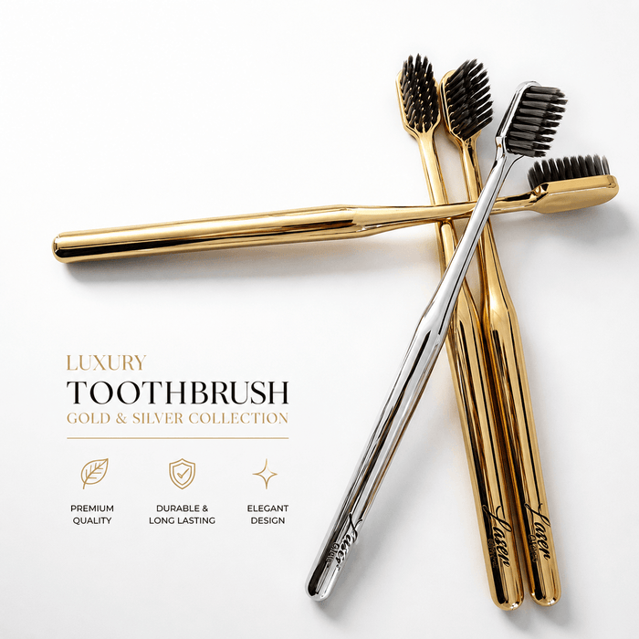 LaserGlow gold and silver soft bristle toothbrushes with metallic handles and black bristles for luxury oral care