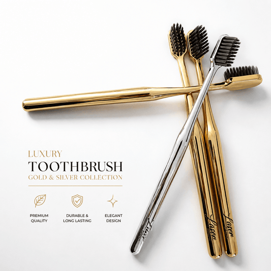 LaserGlow gold and silver soft bristle toothbrushes with metallic handles and black bristles for luxury oral care