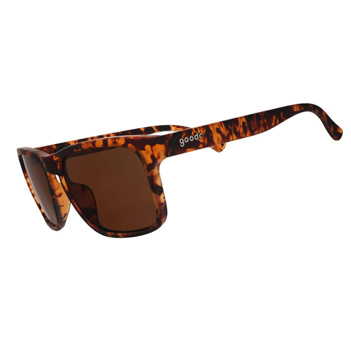 Sunglasses with tortoiseshell frame and brown lenses on a white background