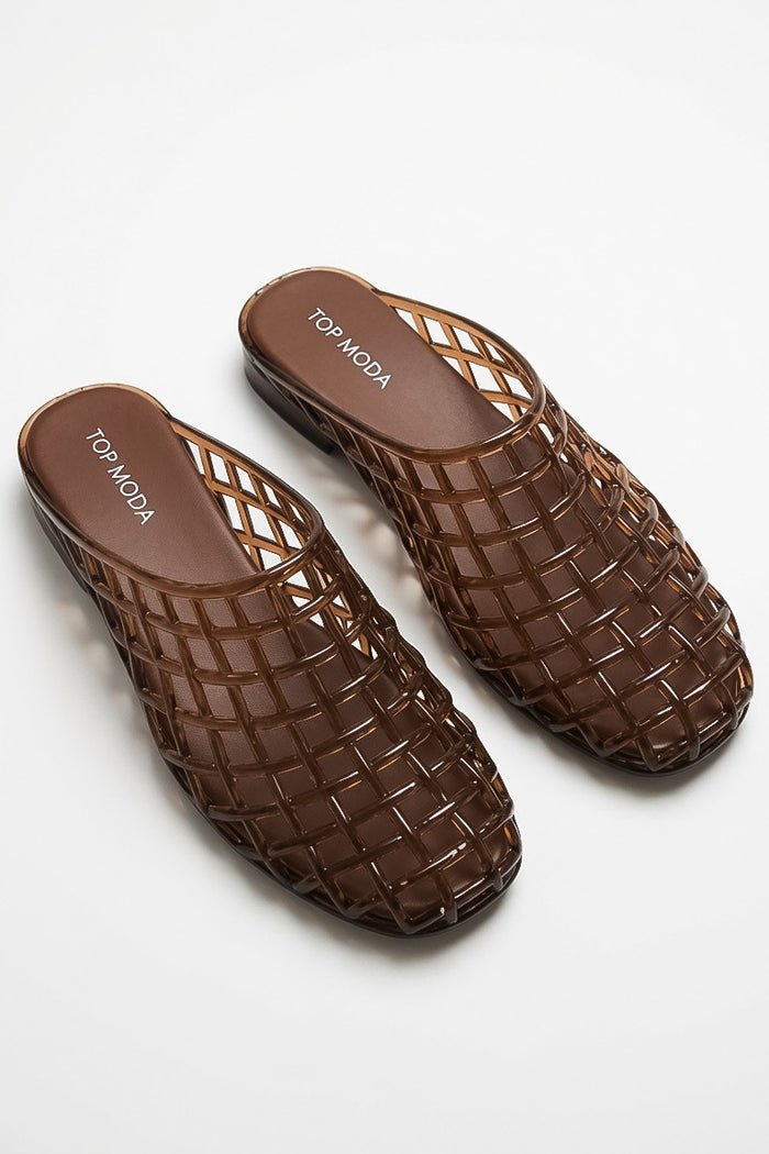 A pair of brown woven mesh mule sandals with a transparent, glossy finish, displayed on a clean white background. The brand name 'TOP MODA' is printed in white on the insole.