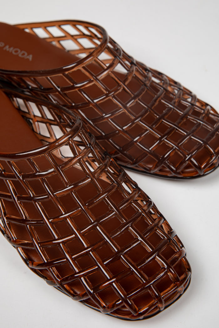 A pair of glossy brown woven mesh mule sandals with a square toe, shown on a clean white background. The brand name 'VOODOO' is partially visible on the insole.