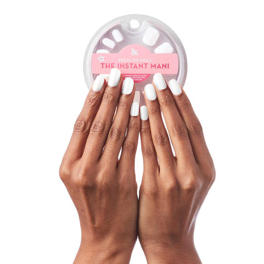 Hands with HD - Press-On | Short | Squoval nails in clean white holding packaged short squoval press-on false nails