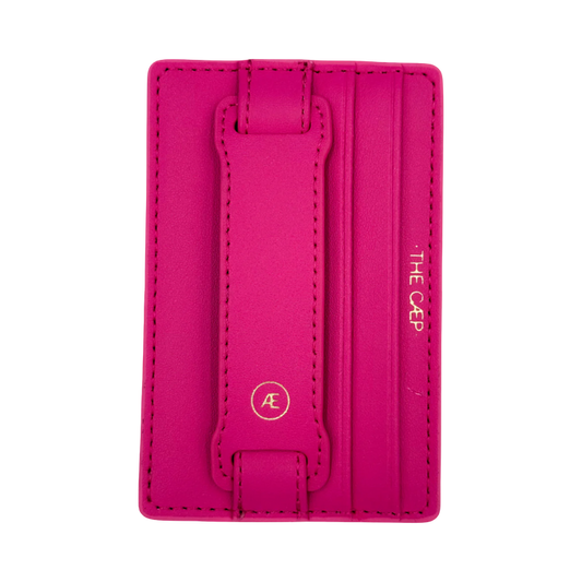 Pink cardholder with brand logo on a white background