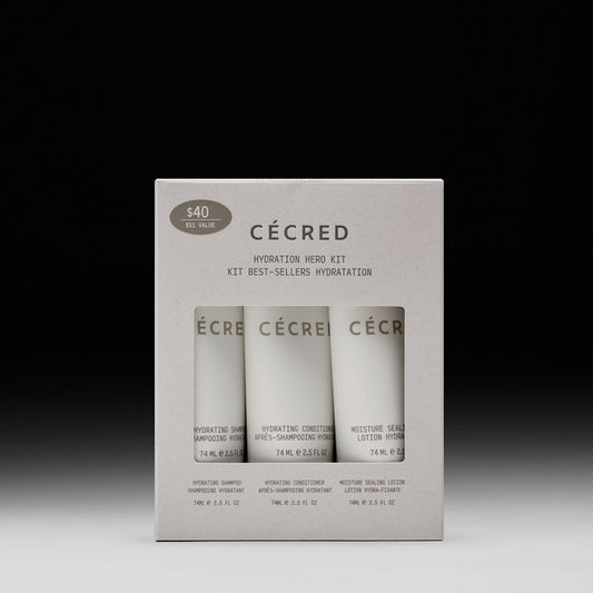 CÉCRED Hydration Hero Kit with three 74ml bottles: hydrating shampoo, hydrating conditioner, and moisture sealing lotion.