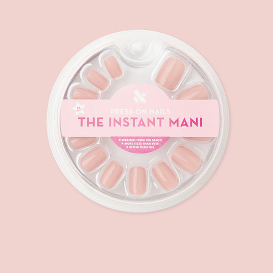 Pack of HZ - Press-On | Short | Squoval rosy-toned neutral false nails in round white packaging on soft pink background