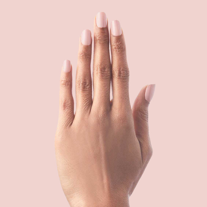 Hand with HZ - Press-On | Short | Squoval rosy neutral false nails on natural medium skin tone for subtle mani