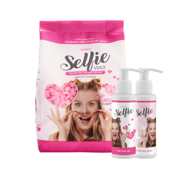 W390 Italwax 500g Selfie Delicate Film Wax | A bag of pink delicate Italwax Selfie Film Wax for facial hair removal and pre and post wax lotions in bottles with a woman's face on a white background