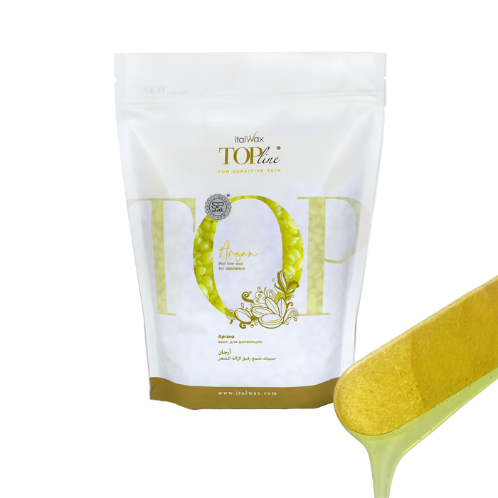 W331 Italwax 1kg Top Line Synthetic Argan Film Wax | A bag of bright yellow wax in a branded Italwax plastic bag with jelly yellow wax beads showing, and in the foreground a wooden spatula with jelly yellow wax dripping