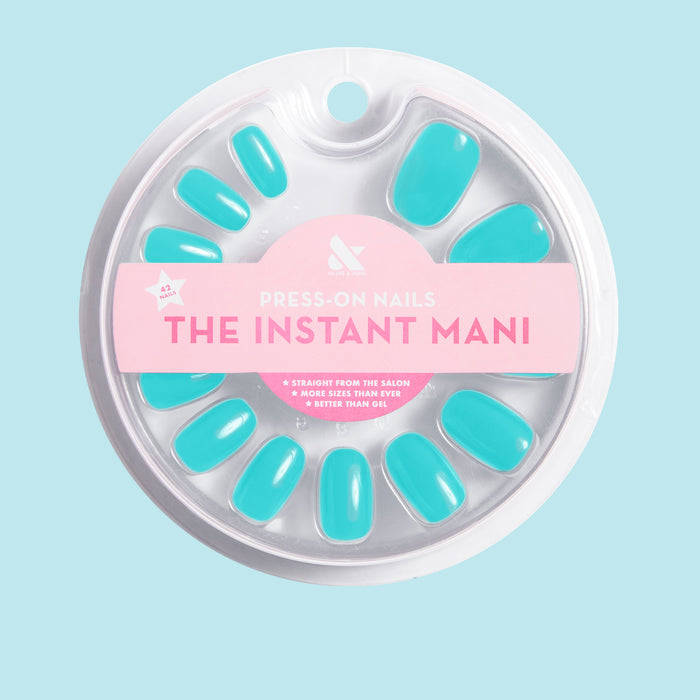Jewel Pop | Round | Short bright nearly neon turquoise blue press-on nails in short round shape for a bold at-home mani