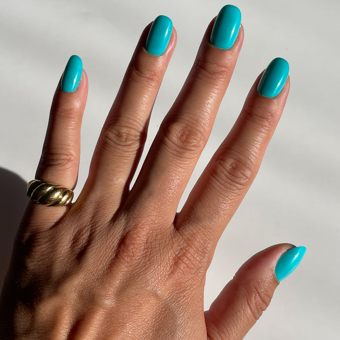 Jewel Pop | Round | Short vibrant turquoise blue press-on nails in a short round shape for an easy at-home mani