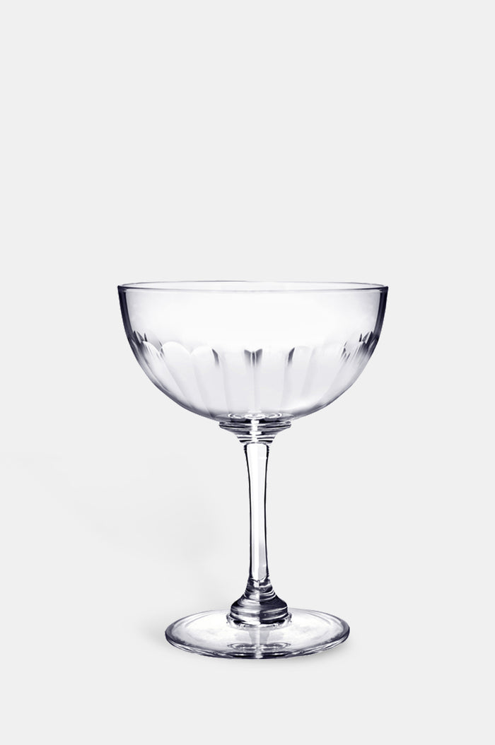The Vintage List lens champagne saucer with band of connecting oval detailing.