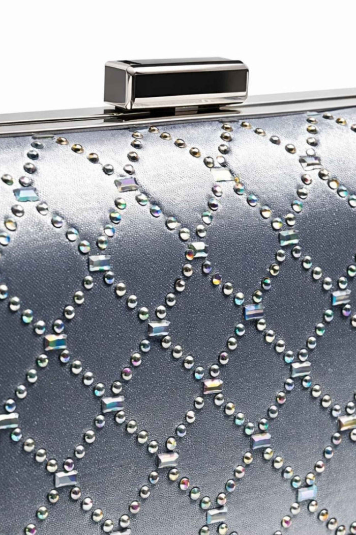 Close-up of silver clutch with rhinestone and crystal embellishments forming a diamond pattern, featuring a sleek metallic clasp for elegant evening wear