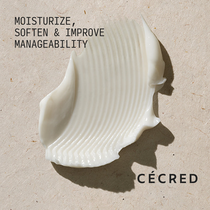 Cécred Moisturizing Deep Conditioner creamy white formula swatch with Moisturize, Soften & Improve Manageability claim text against a warm neutral textured background
