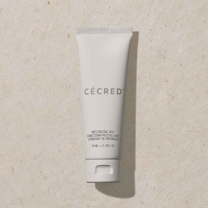 Cécred Moisturizing Deep Conditioner in travel size with matte finish and crisp type, reinforcing hydration benefits in a compact form.