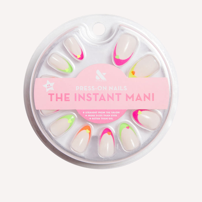 Neon Heart French | Almond | Medium press-on nails with neutral base and neon tips featuring heart design for an at-home mani