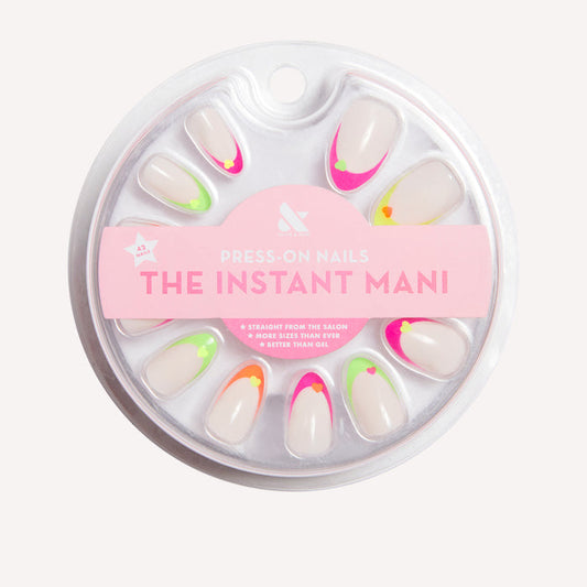 Neon Heart French | Almond | Medium press-on nails with neutral base and neon tips featuring heart design for an at-home mani