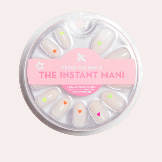 Neon Hearts | Oval | Medium press-on nails with a neutral base and small neon heart accents for an easy at-home mani