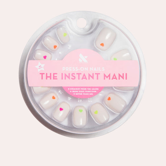 Neon Hearts | Round | Extra Short press-on nails with neutral base and colorful neon heart accents for a quick at-home mani