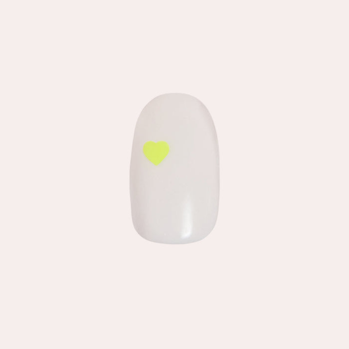Neon Hearts | Round | Extra Short press-on nail with a neutral base and single neon heart for a quick at-home mani