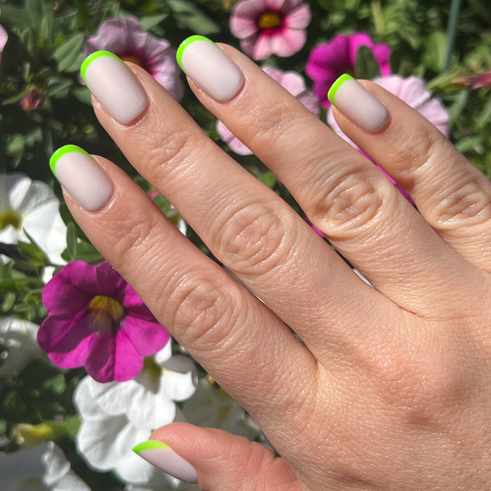 Neon Lime French | Squoval | Short press-on nails with a neutral base and bright neon lime tips for a fresh mani look