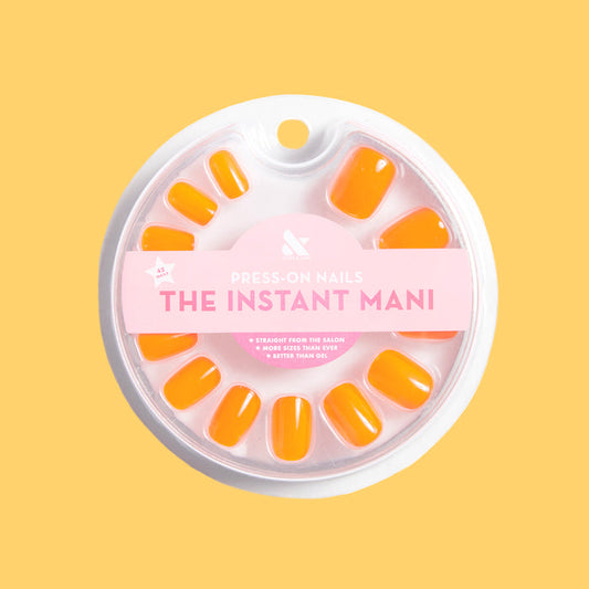 Neon Tangerine | Squoval | Extra Short bright neon orange press-on nails in a squoval shape for a quick at-home mani