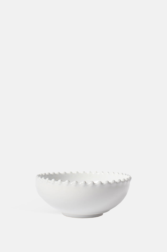 Costa Nova pearl white low sided bowl with peal edging.